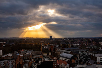 High angle shot of townscape against sky at sunset