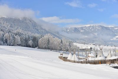 Snow covered mountains against sky