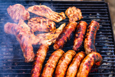 Close-up of meat on barbecue grill