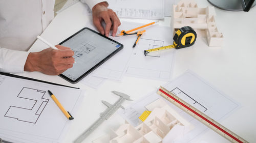 High angle view of business colleagues working on table