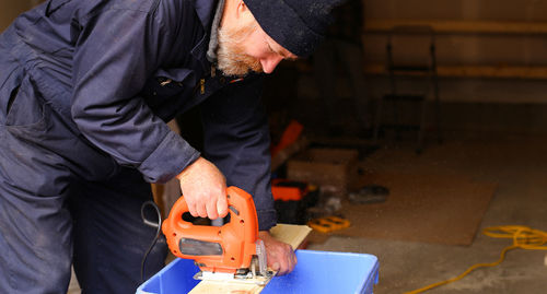 Rear view of man working on stage