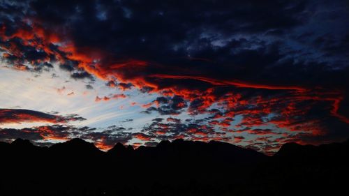 Low angle view of dramatic sky during sunset