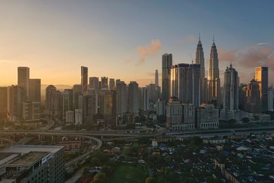 Modern buildings in city against sky