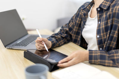 Midsection of man working at office