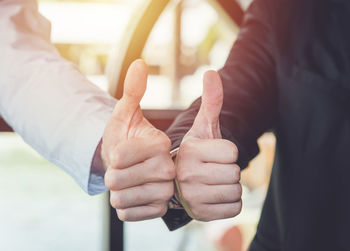 Close-up of man holding hands