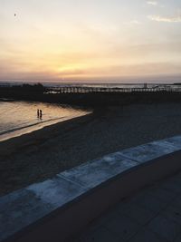 Scenic view of calm sea at sunset