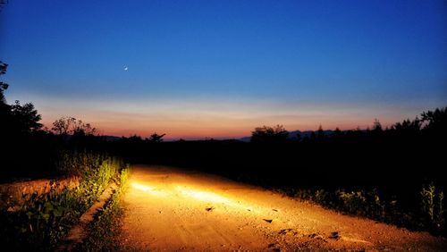 Scenic view of silhouette landscape against clear sky at night