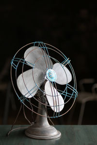 Close-up of electric fan on table