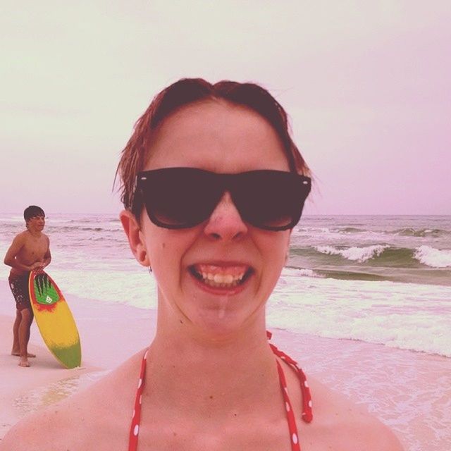 beach, sea, person, water, sunglasses, lifestyles, portrait, leisure activity, young adult, looking at camera, shore, sand, horizon over water, vacations, clear sky, front view, sunlight, young men