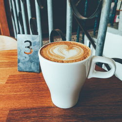 Close-up of coffee cup on table