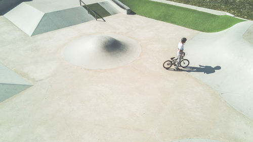 High angle view of man with bicycle