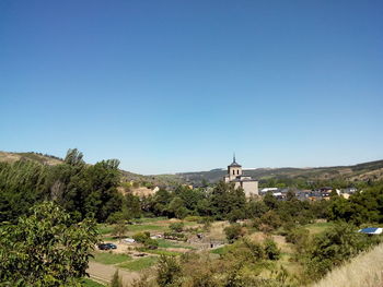 View of landscape against clear blue sky