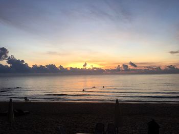 Scenic view of calm sea at sunset