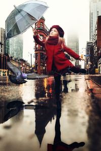 Reflection of woman in puddle