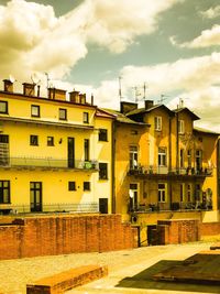 Residential buildings in town against sky