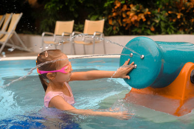 High angle view of boy swimming in pool