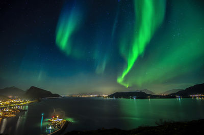 Scenic view of illuminated mountain against sky at night