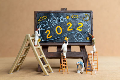 Graffiti on chair against wall