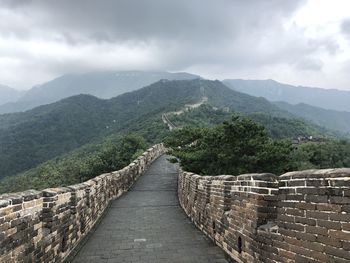 Scenic view of mountain against cloudy sky