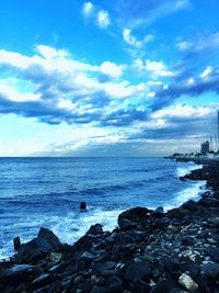 Scenic view of calm sea against blue sky