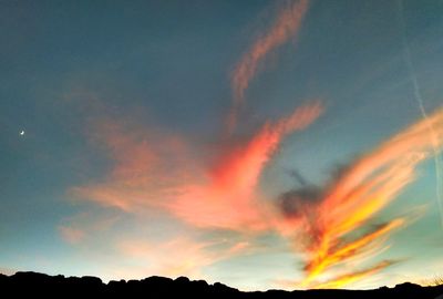 Low angle view of dramatic sky during sunset