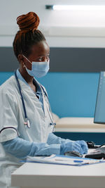 Female doctor working at clinic