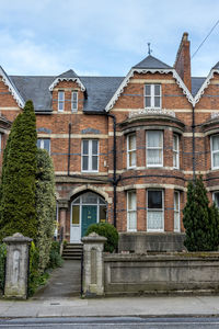 Residential building by road against sky, luxury houses in dublin