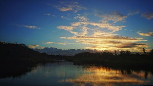 Scenic view of lake against sky during sunset