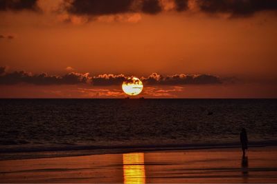 Scenic view of sea against sky at sunset