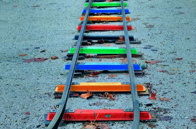 High angle view of multi colored deck chairs on land