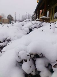 Snow covered in front of winter against clear sky