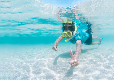 Portrait of man swimming in pool