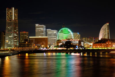 Illuminated buildings in city at night