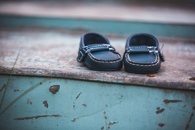 Close-up of shoes on metal steps