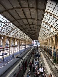 People waiting at railroad station platform