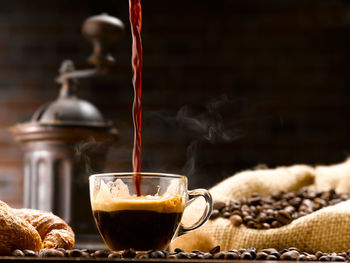 Close-up of coffee beans in glass