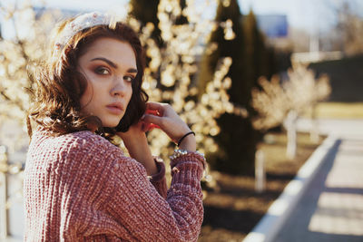 Portrait of young woman outdoors