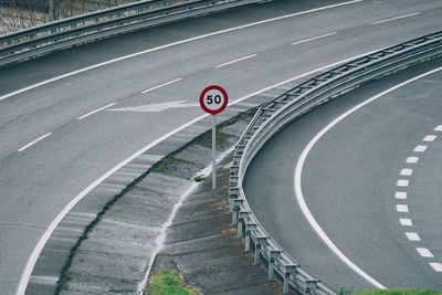 High angle view of road sign on street