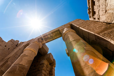 Low angle view of old ruin against blue sky