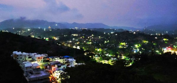 High angle shot of townscape against sky at night