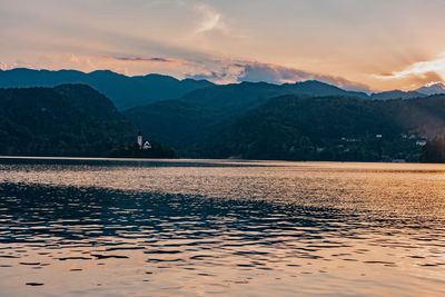 Scenic view of lake against sky during sunset