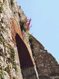 Low angle view of rock formation against clear sky