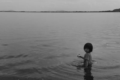 Girl standing in sea