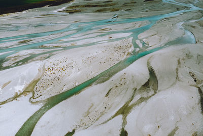 High angle view of wet sand on beach