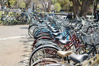 Bicycles parked in row at sidewalk