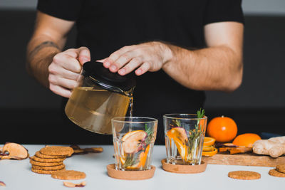 Midsection of man preparing food