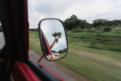 Blurred motion of car on road against sky