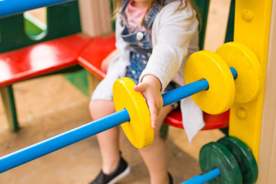 Low angle view of girl playing on playground