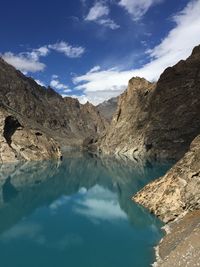 Scenic view of lake and mountains against sky