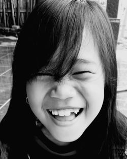Smile little girl on black white